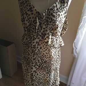 Leopard print, rayon print blouse with tie back.